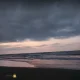 طلوع آفتاب در ساحل ماسه‌ای انارور